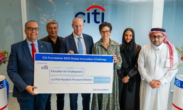 A group of people holding a large check

AI-generated content may be incorrect.