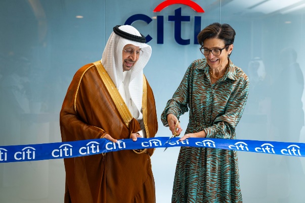 A person cutting a blue ribbon with a person

AI-generated content may be incorrect.